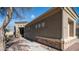 Charming home exterior with a stone facade, well-manicured landscaping, and a stone walkway leading to the entrance at 6774 S Pinehurst Dr, Gilbert, AZ 85298