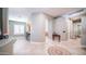 Inviting foyer with beautiful tile work, showcasing an open floor plan and views to the kitchen and hallways at 6774 S Pinehurst Dr, Gilbert, AZ 85298
