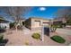 Beautiful single-story home with desert landscaping and stone accents on a sunny day at 6774 S Pinehurst Dr, Gilbert, AZ 85298