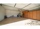 Spacious garage with epoxy flooring, built-in cabinets, and ample storage space for vehicles and hobbies at 6774 S Pinehurst Dr, Gilbert, AZ 85298