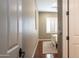 Comfortable hallway leads into a bright bedroom with shuttered windows and warm hardwood flooring at 6774 S Pinehurst Dr, Gilbert, AZ 85298