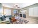 Comfortable living room with a fireplace, plush seating, and a neutral color palette at 6774 S Pinehurst Dr, Gilbert, AZ 85298