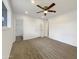 Spacious bedroom with a ceiling fan and carpet at 709 S Toltec --, Mesa, AZ 85204