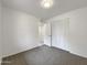Bright bedroom with white walls, plush carpet, and closet at 709 S Toltec --, Mesa, AZ 85204