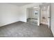 Bedroom featuring plush carpet, mirrored closet, and natural light at 709 S Toltec --, Mesa, AZ 85204