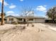 Charming single-story home with desert landscaping and a well-maintained front yard, under a bright blue sky at 709 S Toltec --, Mesa, AZ 85204