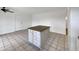 Center island features drawers and cabinets, adding extra storage and countertop space to this kitchen at 709 S Toltec --, Mesa, AZ 85204