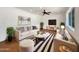 Bright living room features stylish furnishings, recessed lighting, and a large window for natural light at 709 S Toltec --, Mesa, AZ 85204