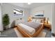 Cozy main bedroom with neutral tones, plush bedding, and ample natural light from the window at 709 S Toltec --, Mesa, AZ 85204