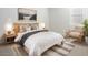 Comfortable bedroom featuring a plush bed, stylish decor, and ample natural light at 7414 W Whitehorn Trl, Peoria, AZ 85383