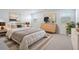 Well-lit bedroom with neutral décor, large windows, and stylish furnishings at 7414 W Whitehorn Trl, Peoria, AZ 85383