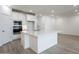 Bright kitchen with white cabinetry, stainless steel appliances, and a large center island at 7414 W Whitehorn Trl, Peoria, AZ 85383