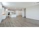 Spacious open-concept living room with white walls, tile flooring, and recessed lighting at 7414 W Whitehorn Trl, Peoria, AZ 85383