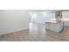 Open-concept living space with kitchen featuring white cabinets, tile flooring and light-filled interior at 7414 W Whitehorn Trl, Peoria, AZ 85383
