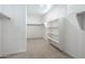 Spacious walk-in closet with built-in shelving and ample storage space at 7414 W Whitehorn Trl, Peoria, AZ 85383