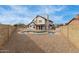 Large backyard featuring a fenced pool and low-maintenance desert landscaping, perfect for outdoor enjoyment at 7637 W North Ln, Peoria, AZ 85345