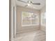 Bright bedroom featuring a ceiling fan, closet and a view of the neighborhood at 7637 W North Ln, Peoria, AZ 85345