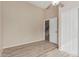 A light-filled bedroom has a ceiling fan, closet, and door to stairs for easy access at 7637 W North Ln, Peoria, AZ 85345