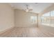 Versatile bonus room with updated flooring, natural light, and neutral paint, ideal for various uses at 7637 W North Ln, Peoria, AZ 85345