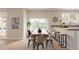 Inviting dining area with a wooden table set and access to the outdoor pool area at 7637 W North Ln, Peoria, AZ 85345