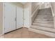 Welcoming entryway featuring tile floors, staircase with updated treads, and a convenient coat closet at 7637 W North Ln, Peoria, AZ 85345