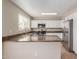 Modern kitchen features white cabinets, stainless steel appliances, and sleek countertops for a stylish look at 7637 W North Ln, Peoria, AZ 85345