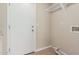Laundry Room with neutral color walls, access door, and connections for a washer and dryer at 7637 W North Ln, Peoria, AZ 85345