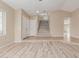 Open-concept living room with updated flooring and natural light; a versatile and inviting space at 7637 W North Ln, Peoria, AZ 85345