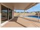 Covered patio overlooking fenced in pool at 7637 W North Ln, Peoria, AZ 85345