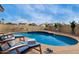Backyard pool area with lounge seating at 7637 W North Ln, Peoria, AZ 85345