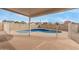 Covered patio overlooking fenced in pool at 7637 W North Ln, Peoria, AZ 85345