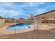 Fenced pool in backyard with covered patio at 7637 W North Ln, Peoria, AZ 85345