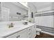 Well-lit bathroom with a vanity, shower featuring a curtain and a toilet at 7769 S Reseda St, Gilbert, AZ 85298