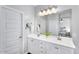 Bright bathroom features a double vanity with white cabinets and modern fixtures at 7769 S Reseda St, Gilbert, AZ 85298