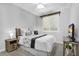 Cozy bedroom featuring a queen-sized bed, stylish decor, and neutral color palette at 7769 S Reseda St, Gilbert, AZ 85298