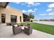 Clubhouse patio with seating and serene lake views with a fountain at 7769 S Reseda St, Gilbert, AZ 85298