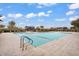 Spacious community pool with a shallow area and playground nearby at 7769 S Reseda St, Gilbert, AZ 85298