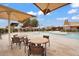 Community pool with covered lounge areas, splashpad, and ample seating at 7769 S Reseda St, Gilbert, AZ 85298