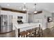 Well-equipped kitchen featuring a center island, stainless steel appliances, and modern white cabinetry at 7769 S Reseda St, Gilbert, AZ 85298