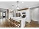 Modern kitchen with a large island, stainless steel appliances, and stylish lighting fixtures at 7769 S Reseda St, Gilbert, AZ 85298