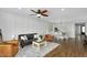 Open-concept living room with modern furniture, a dining area, and plenty of natural light at 7769 S Reseda St, Gilbert, AZ 85298