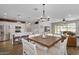 Spacious area with a contemporary kitchen, dining area, and a comfortable living space at 7769 S Reseda St, Gilbert, AZ 85298