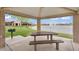 Community picnic area with tables and grill overlooking a picturesque lake at 7769 S Reseda St, Gilbert, AZ 85298