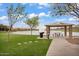 Beautiful lakeside picnic area with a shelter, table, grill, and walking paths at 7769 S Reseda St, Gilbert, AZ 85298
