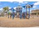 Community playground featuring slides, climbing structures, and covered areas for sun protection at 7769 S Reseda St, Gilbert, AZ 85298