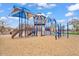 Community playground featuring slides, climbing structures, and covered areas for sun protection at 7769 S Reseda St, Gilbert, AZ 85298
