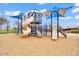 Community playground featuring slides, climbing structures, and covered areas for sun protection at 7769 S Reseda St, Gilbert, AZ 85298