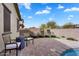 Inviting backyard pool area with outdoor lounge chairs and artificial turf at 7769 S Reseda St, Gilbert, AZ 85298
