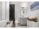This well-appointed bathroom features modern vanity, shower, and updated toilet at 8345 E Oak St, Scottsdale, AZ 85257