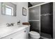 Updated bathroom features modern vanity, shower with sleek tile and glass door at 8345 E Oak St, Scottsdale, AZ 85257
